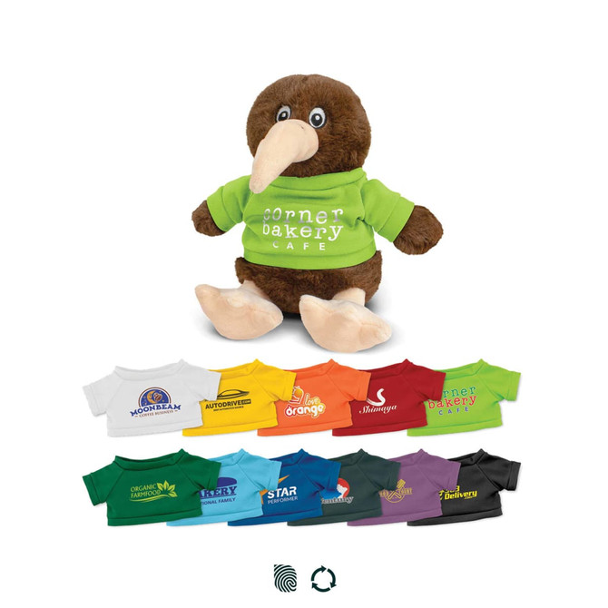 A brown kiwi plush toy wearing a green shirt, surrounded by various coloured t-shirts featuring logos.