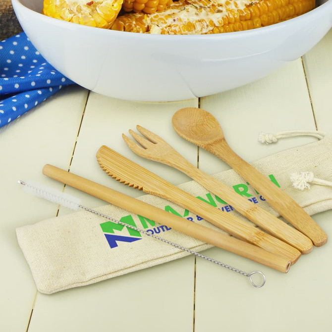 A bamboo cutlery set including a spoon, fork, knife, straw, and cleaning brush, all in a natural tone, with a storage bag.