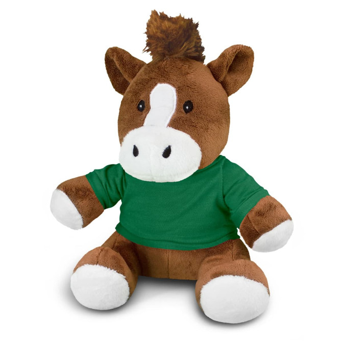 A brown horse plush toy wearing a green T-shirt, featuring white accents on its face and paws. It has a tuft of brown hair.