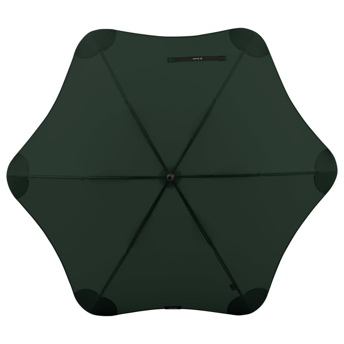 A green BLUNT Classic Umbrella with a unique star-shaped design and a central opening mechanism. Features a logo.