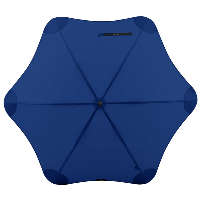A navy blue umbrella with a star-shaped design and a central opening, featuring a logo on the handle.