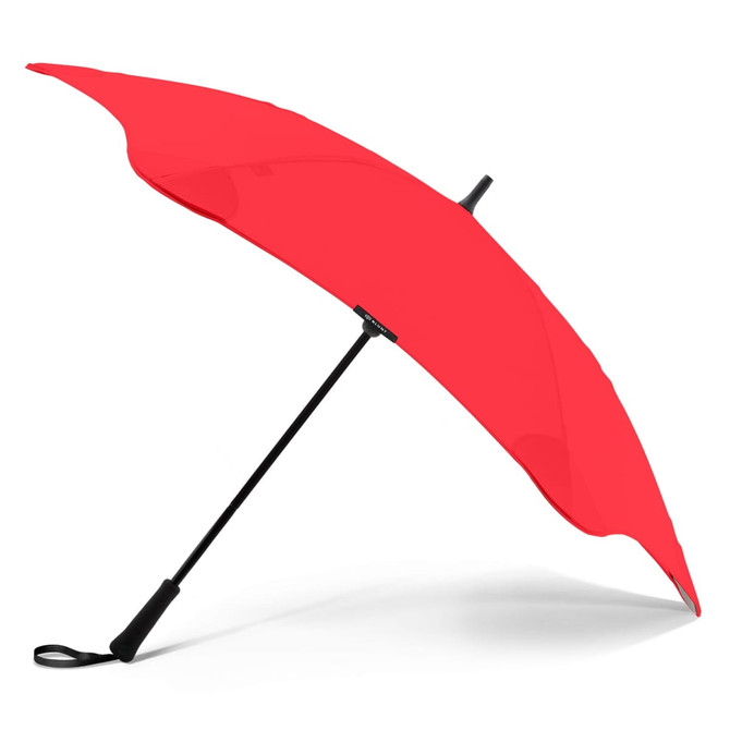 A red BLUNT Classic Umbrella with a black handle and a sleek design, featuring a logo on the shaft.