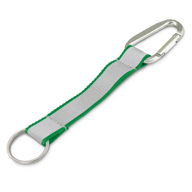 A green and grey reflector key ring featuring a carabiner and a metal ring. It includes a logo on the fabric.