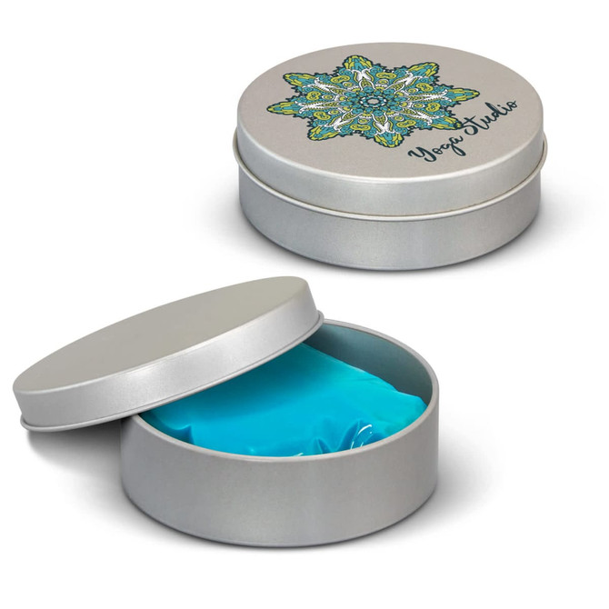 A silver tin with an intricate lid design, containing bright blue stress putty inside.