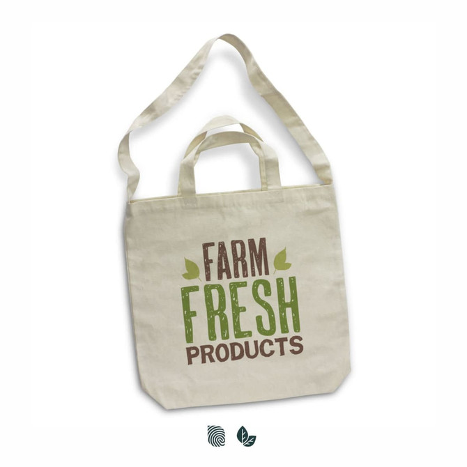 A cotton shoulder tote bag in cream, featuring a logo and text "Farm Fresh Products" in green and brown.