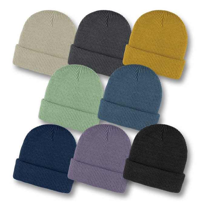 A collection of Galway Waffle Beanies in various colours: grey, yellow, green, navy, purple, black, and cream.