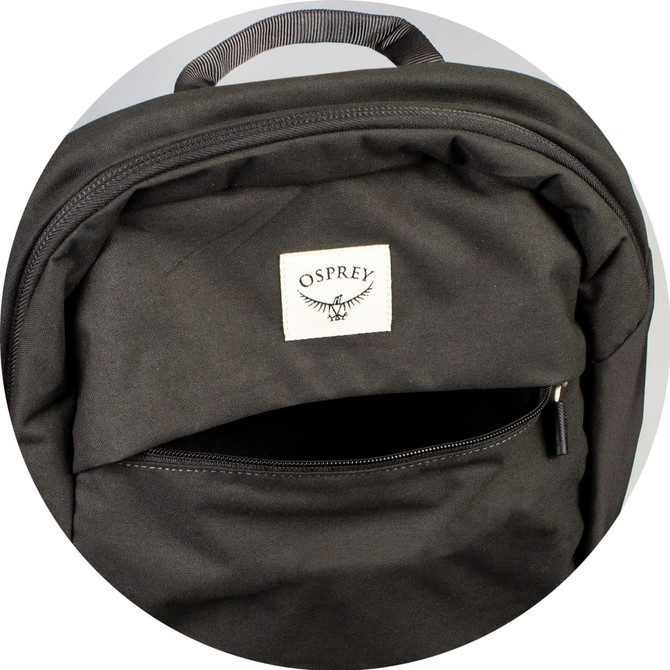 A black backpack featuring a front zip pocket and a logo patch on the front.