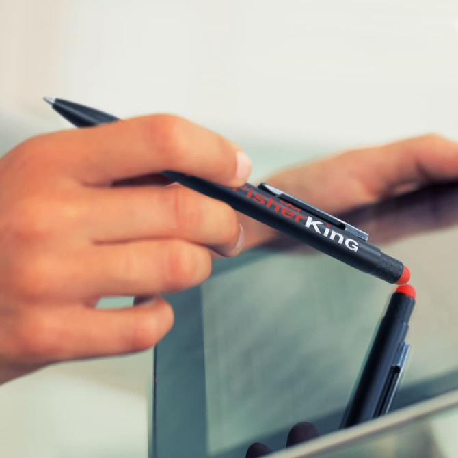 A black stylus pen with a red tip is held above a reflective surface, featuring a logo.