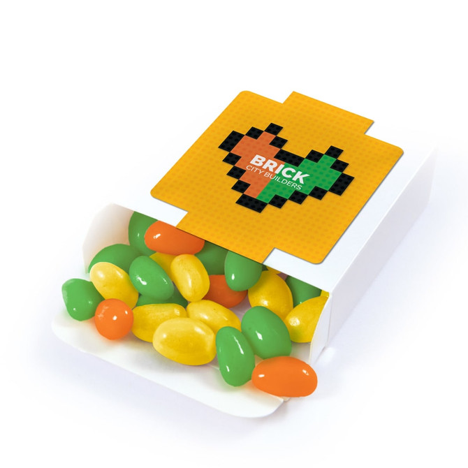 A box of jelly beans, featuring green, yellow, and orange colours, with a branded lid design.