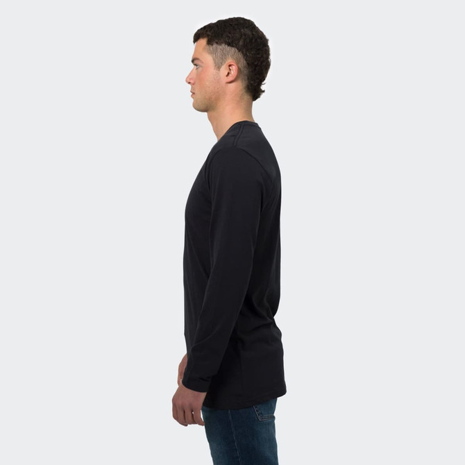 A long sleeve crew shirt in black, displayed on a male model from the side. The shirt has a simple design and logo.