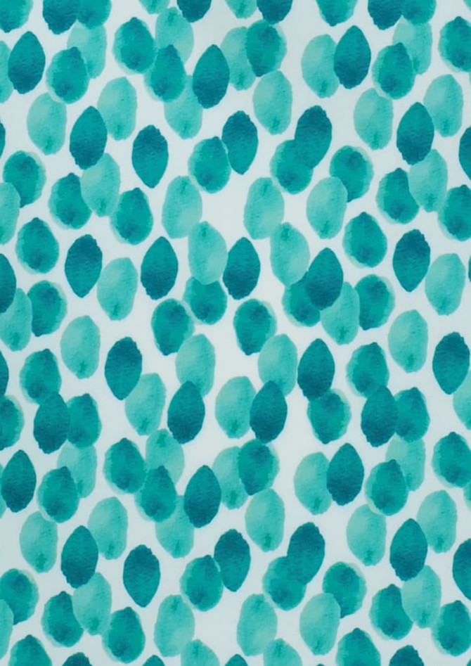 A patterned fabric featuring a stardust design in shades of teal and aqua on a white background.
