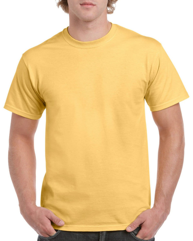 A plain yellow heavy cotton adult T-shirt featuring short sleeves and a crew neck. The model stands with hands in pockets.
