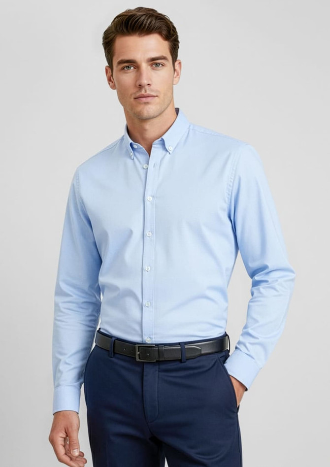 A light blue long sleeve button-up shirt on a model, featuring a collar and tailored fit.