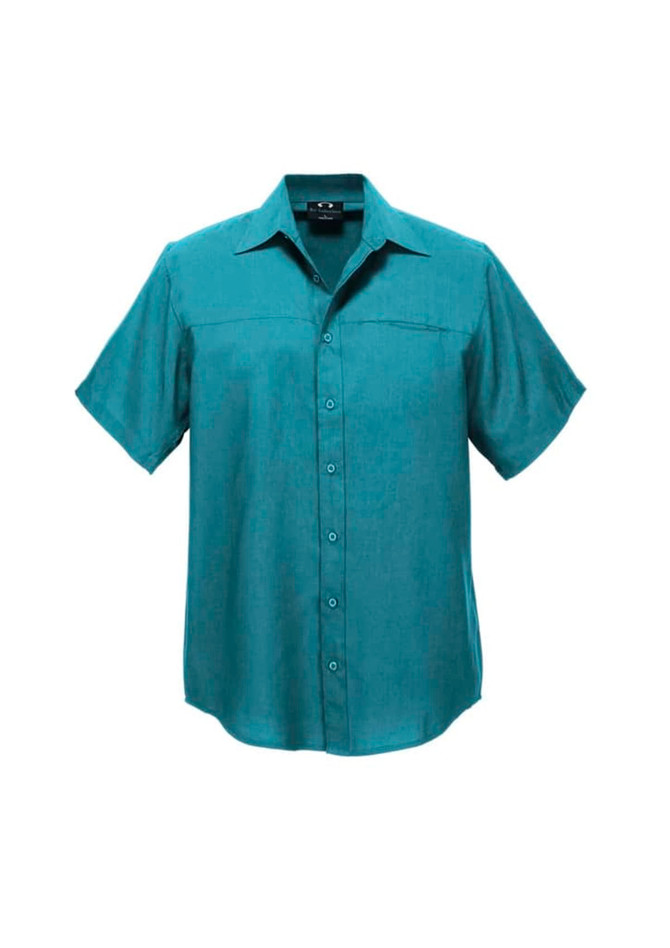 A teal short sleeve button-up shirt with a pocket and a logo on the chest.