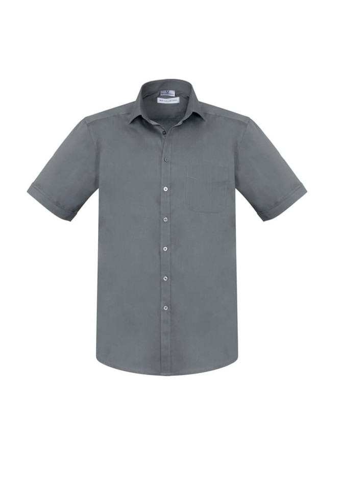 A grey short sleeve button-up shirt with a pocket and a logo on the label.