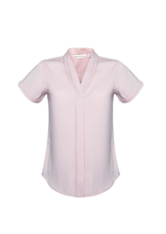 A short sleeve button-up shirt in a soft pink colour, featuring a v-neck design and a logo on the label.