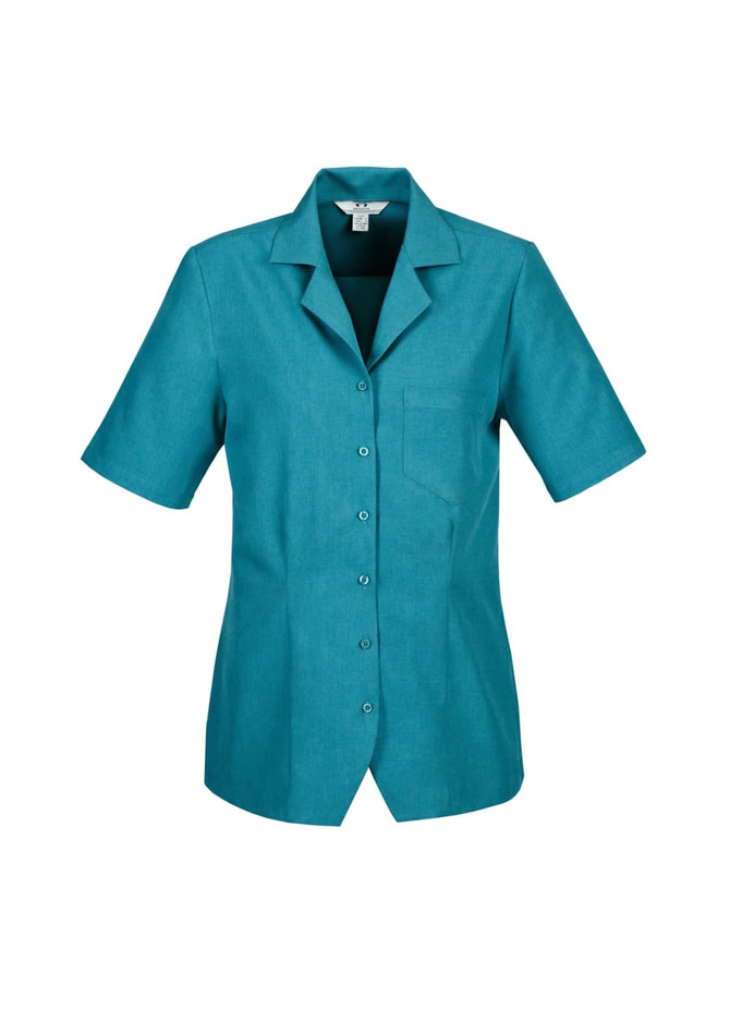 A teal short-sleeve overblouse with a collar and a chest pocket, featuring buttons down the front and a logo.
