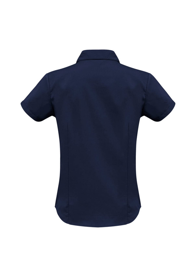 A navy blue women's short sleeve button-up shirt featuring a collar and a curved hem. It has a logo on it.