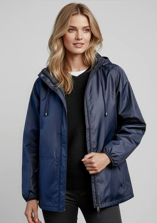 A navy unisex Spinnaker jacket with a hood, featuring a logo. The model is wearing it over a black top.