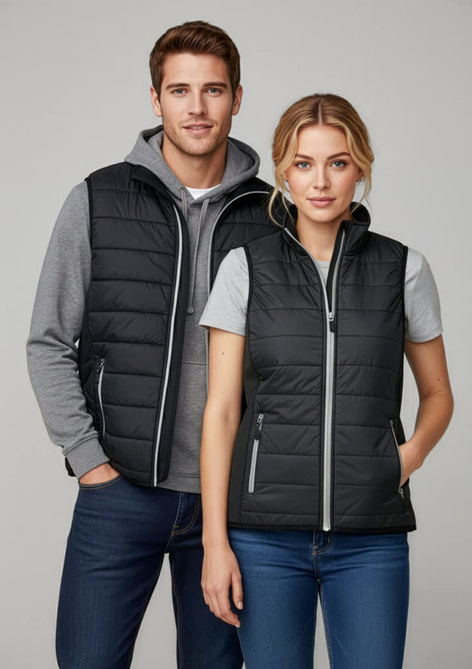 A black women's vest with a zip front, paired with a grey hoodie. Both models are wearing casual attire.