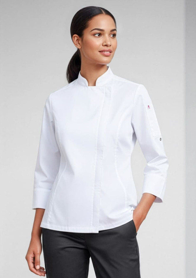 A white long sleeve chef jacket worn by a woman, featuring a stylish collar and a logo on the sleeve.