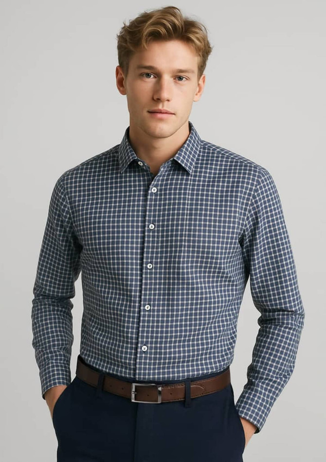 A button-up shirt in navy blue with a checked pattern, featuring long sleeves and a collar. It has a logo.