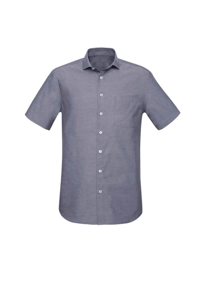 A short sleeve button-up shirt in a blue grey tone with a pocket and a logo on the chest.