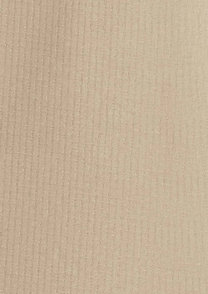 A textured fabric in a light beige colour, suitable for a women's long sleeve shirt.
