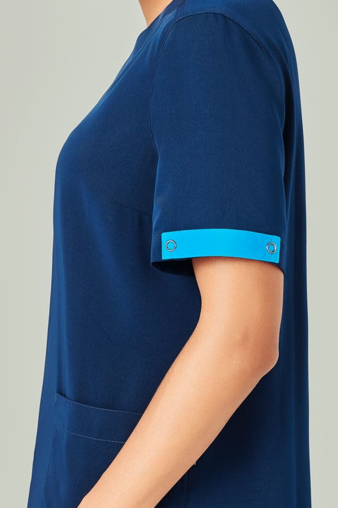 Unisex navy blue scrub top featuring blue accents on the sleeves and an embroidered logo.