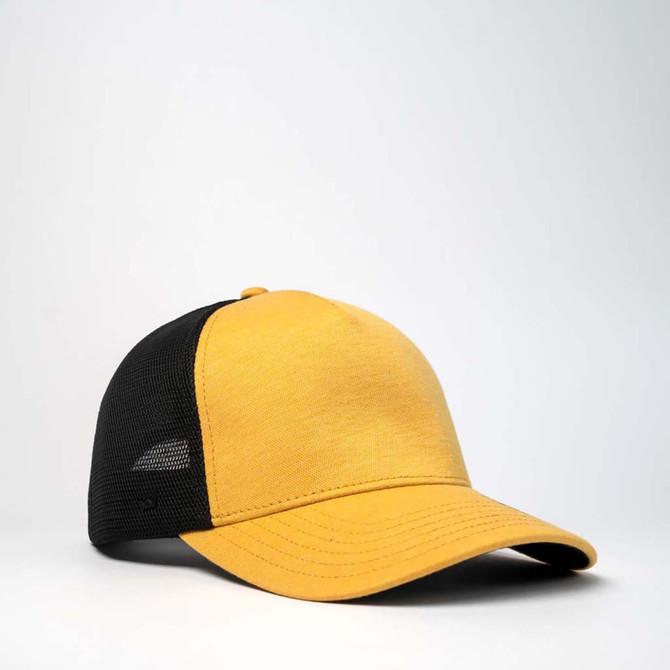 A yellow and black trucker cap with a mesh back and a curved brim, featuring a logo on the side.