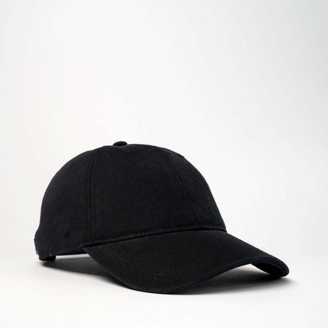 A black cotton canvas unstructured six-panel cap with a curved brim and logo detail.