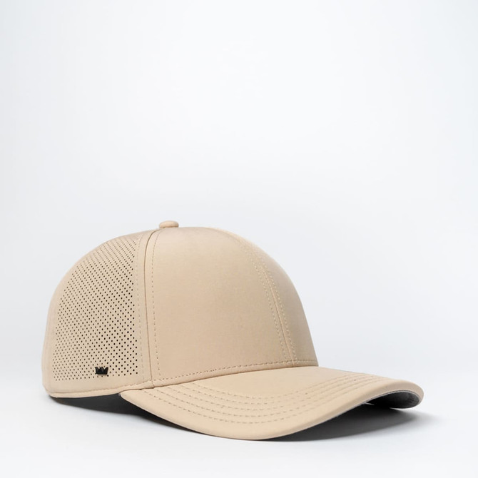 A beige sports cap with a ventilated design and a black brim, featuring a logo on the side.