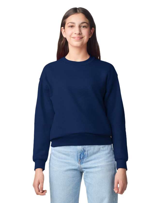 A navy blue youth sweatshirt with a round neckline and ribbed cuffs displayed on a young model.