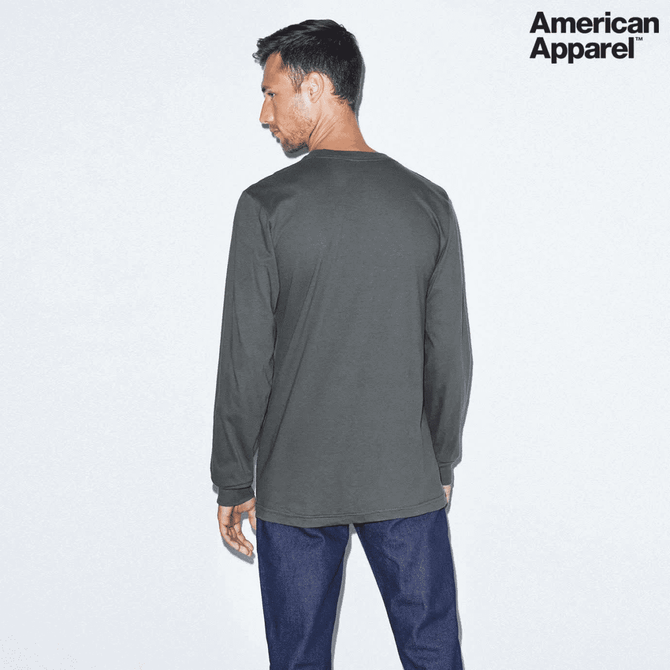 A long sleeve fine jersey T-shirt in dark grey, featuring a logo on the upper corner.