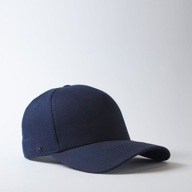 A navy blue UFlex Adults Pro Style 5 Panel Snapback cap with a logo.