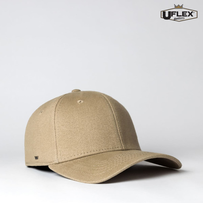A beige fitted cap with a curved brim and a logo on the side, showcasing a smooth fabric texture.