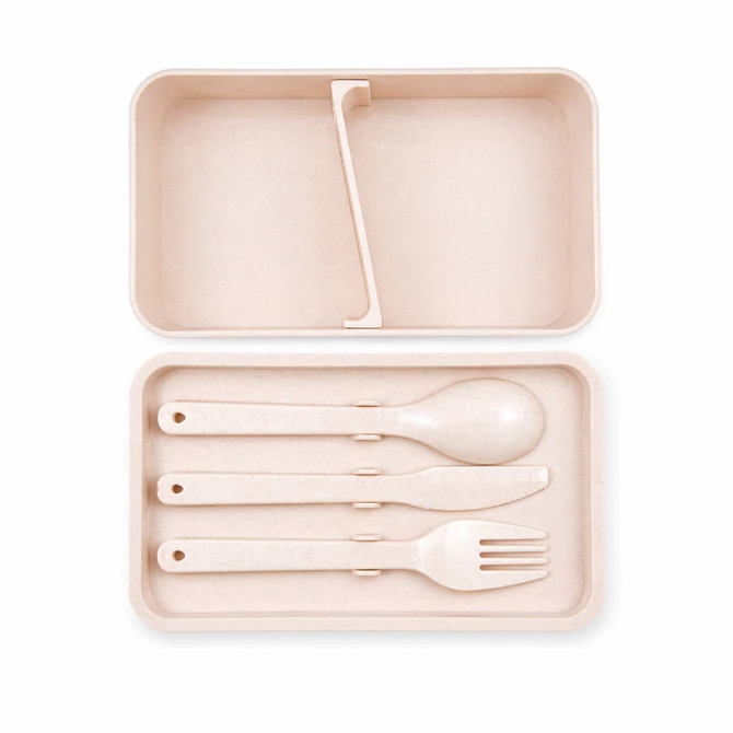 A pink eco lunch box with a phone holder lid, containing a spoon, fork, and knife. It has a minimalist design.