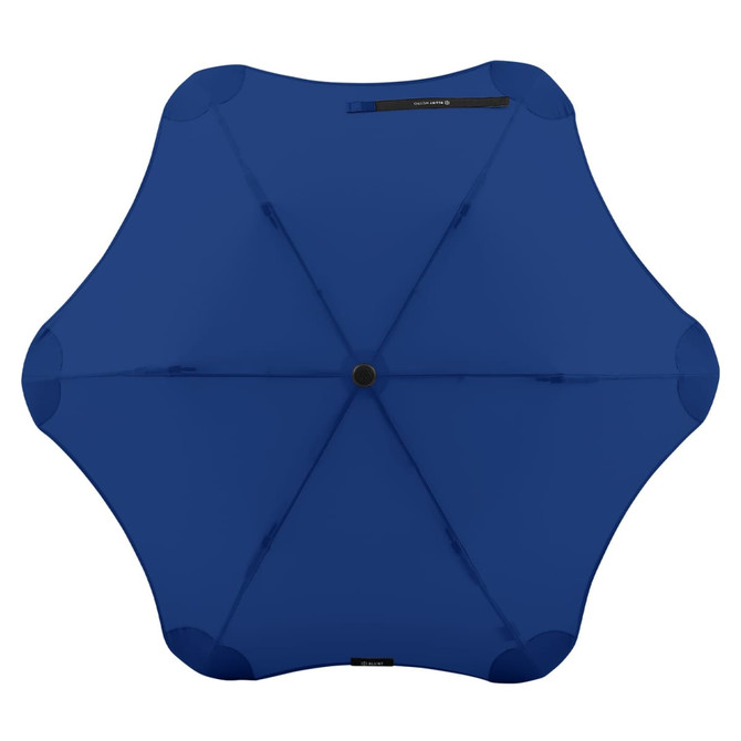 A blue BLUNT Metro Umbrella with a unique design and a central button for opening. It features a logo on the handle.