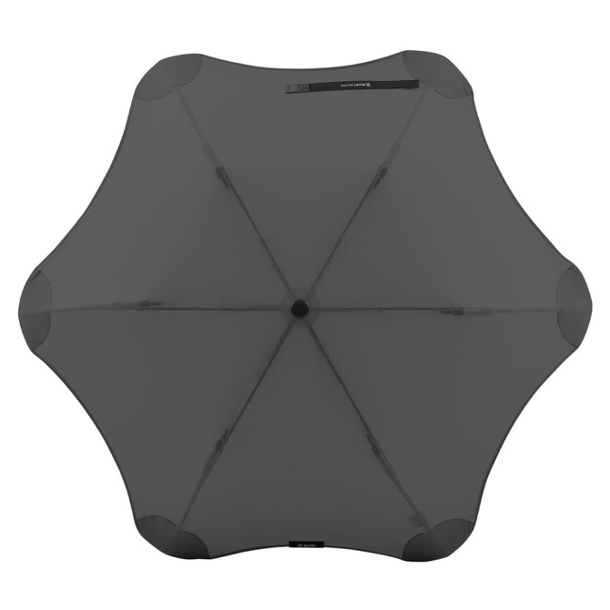 A black BLUNT Metro Umbrella, showcasing its unique shape and structure from an overhead view.