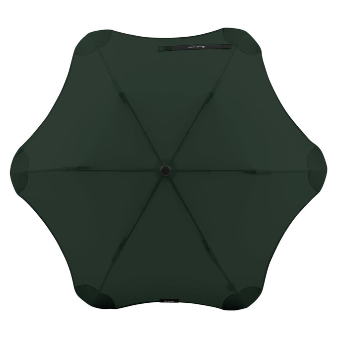 A dark green BLUNT Metro Umbrella with a distinctive octagonal shape and a central button for opening.