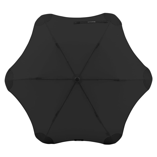 A black umbrella with a unique, rounded shape, featuring a central hub and spokes, displayed from above.