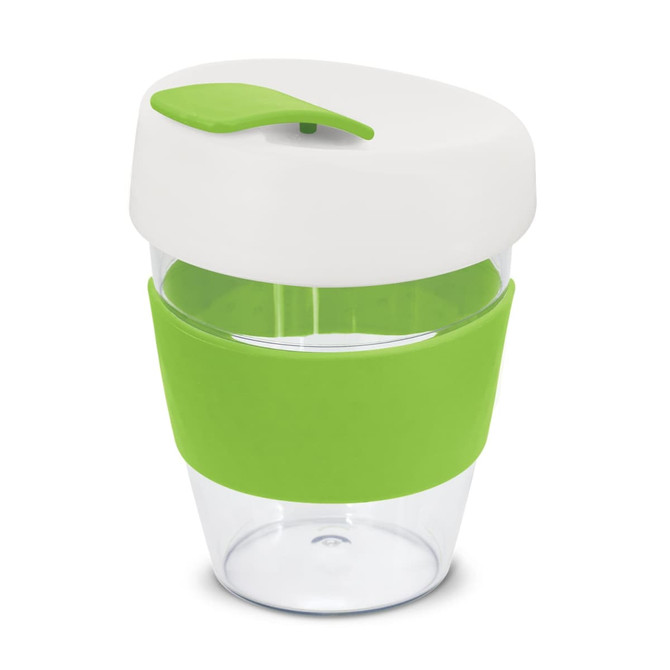 A reusable coffee cup with a clear body, white lid, and green silicone sleeve and top. It features a logo.
