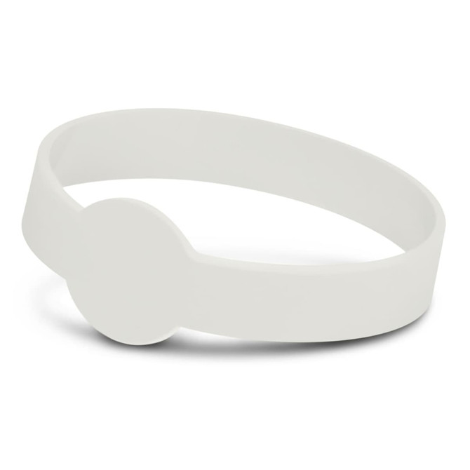 A glow-in-the-dark silicone wristband in white, featuring a circular design element and a smooth surface.