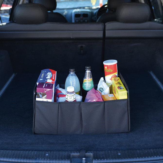 A black cargo storage organiser holds various drinks and food items in a car boot.