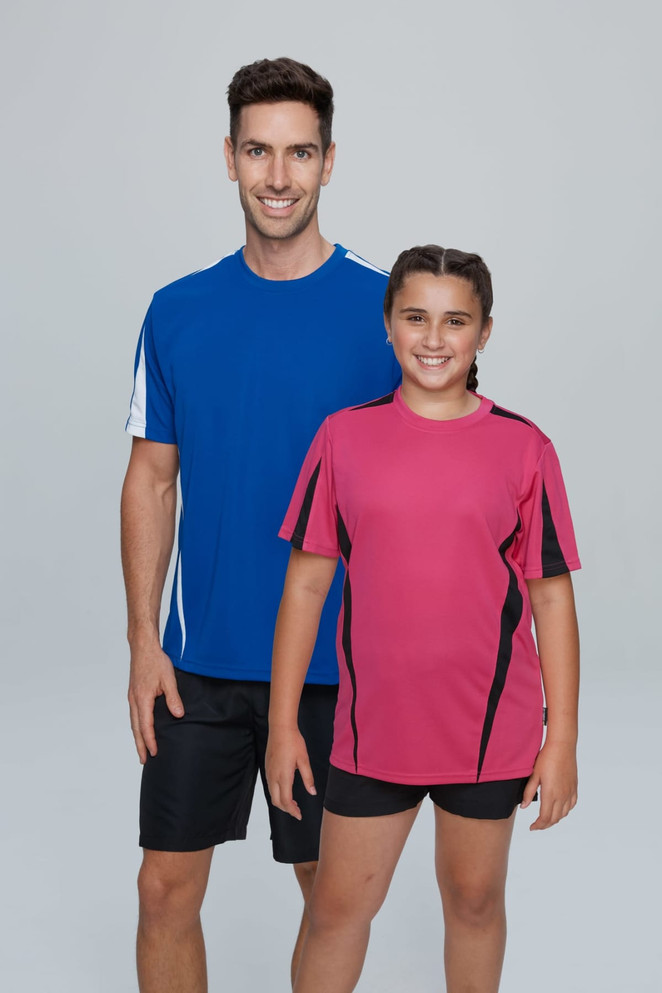 A blue men's t-shirt and a pink girl's t-shirt, both with contrasting panels and short sleeves. The model stands against a neutral background.