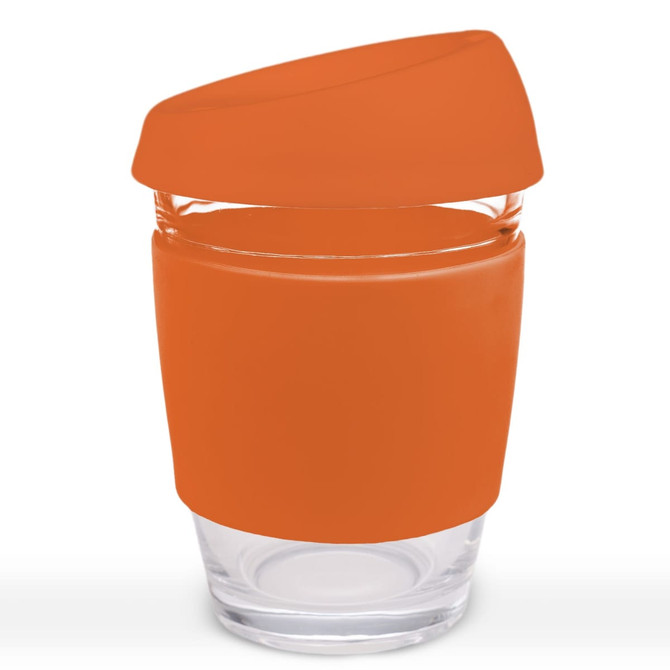 A reusable coffee cup with an orange silicone lid and band, featuring a transparent glass body and a logo.