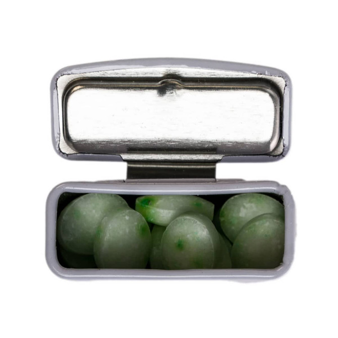 A flip-top tin containing green spearmint mints. The tin is silver with a shiny interior.