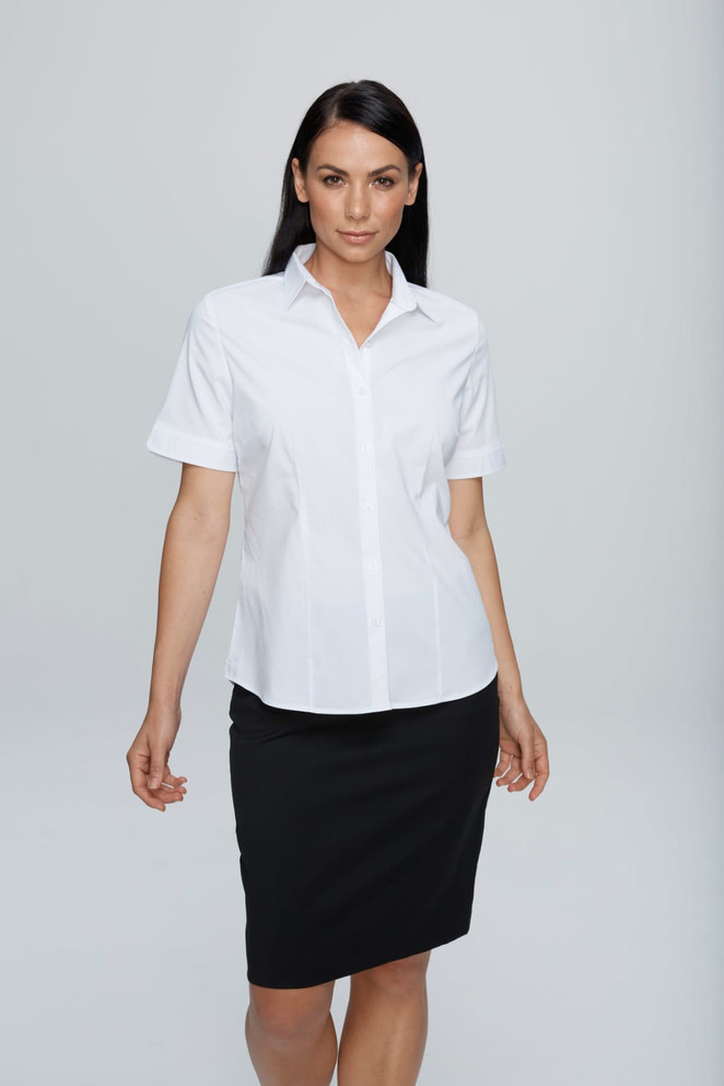 A short-sleeve button-up shirt in white, featuring a classic collar, paired with a black skirt. The shirt has a logo.