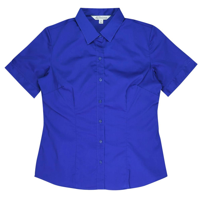 A blue short sleeve button-up shirt with a collar and a logo on the label.