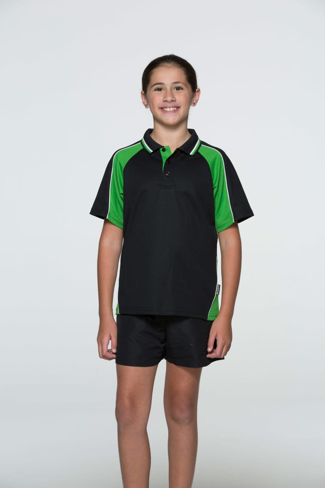 A black polo shirt with green accents, featured on a child standing in a neutral background. The shirt has a logo.